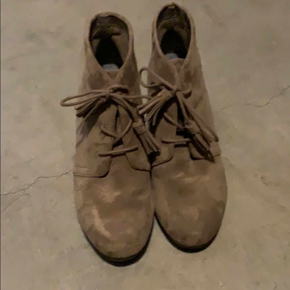 Brown wedge booties.